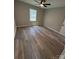 Bedroom with a ceiling fan, hardwood floors, and a window at 203 Blanche Ave, Belmont, NC 28012