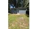 Detached garage featuring a pedestrian door and ample yard space at 203 Blanche Ave, Belmont, NC 28012