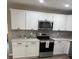Contemporary kitchen with stainless steel appliances and white cabinetry at 203 Blanche Ave, Belmont, NC 28012