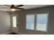 Bright living room with wood-look floors, ceiling fan, and natural light at 203 Blanche Ave, Belmont, NC 28012
