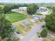 Overhead shot displaying the homes' positioning amongst lush trees, with ample parking and green spaces at 204 13Th St, Belmont, NC 28012