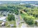 A high angle shot showing homes nestled among lush trees and open spaces, offering a serene environment at 204 13Th St, Belmont, NC 28012