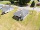 Aerial view of a single-Gathering home with a large yard and nearby houses in a residential neighborhood at 204 13Th St, Belmont, NC 28012