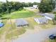 Aerial view of two cozy homes on a spacious lot with mature trees and a large grassy area at 204 13Th St, Belmont, NC 28012