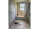 Bathroom featuring a tub/shower combo needing restoration, showing signs of wear at 204 13Th St, Belmont, NC 28012