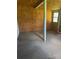 Empty room ready for renovation, featuring plywood and a single window at 204 13Th St, Belmont, NC 28012