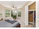 Bright bedroom with large windows, carpet flooring, and a spacious closet at 216 S Clarkson St # E, Charlotte, NC 28202