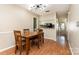 Dining room with hardwood floors, neutral paint, and lighting fixture at 216 S Clarkson St # E, Charlotte, NC 28202