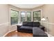 Bright living room area with large windows and a comfortable sofa, perfect for relaxing and entertaining at 216 S Clarkson St # E, Charlotte, NC 28202