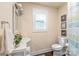 Charming bathroom with sink, toilet, window, and decorative wall art at 219 Lee St, Fort Mill, SC 29715