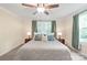 Comfortable bedroom with ample natural light, neutral tones, and a ceiling fan at 219 Lee St, Fort Mill, SC 29715