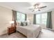 Inviting bedroom with large windows, neutral colors and plush bedding at 219 Lee St, Fort Mill, SC 29715