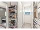 Organized closet with shoe rack, shelving, and natural light from a window at 219 Lee St, Fort Mill, SC 29715