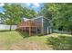 Back exterior view of a blue home with a wooden deck and access to the backyard at 219 Lee St, Fort Mill, SC 29715