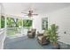 Relaxing covered front porch with ceiling fan, neutral furniture, and a view of the outdoors at 219 Lee St, Fort Mill, SC 29715