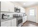 Well-appointed kitchen with stainless appliances, subway tile backsplash and granite countertops at 219 Lee St, Fort Mill, SC 29715