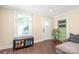 Cozy living room with hardwood floors, large windows, and a comfortable seating area at 219 Lee St, Fort Mill, SC 29715