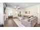 Comfortable living room with a large sectional sofa, fireplace, and ample natural light at 219 Lee St, Fort Mill, SC 29715