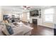 Bright living room with a large sectional, fireplace, mounted TV, and access to the kitchen at 219 Lee St, Fort Mill, SC 29715