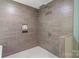 Modern tiled shower with rainfall shower head, and small niche for toiletries at 219 Lee St, Fort Mill, SC 29715