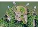 Aerial view of a waterfront estate featuring a private dock, lush landscaping, and luxurious living at 230 Shady Cove Rd, Troutman, NC 28166