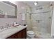 Updated bathroom features a shower with glass doors, vanity, and modern fixtures and finishes at 230 Shady Cove Rd, Troutman, NC 28166