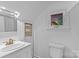 Bathroom featuring a vanity with gold hardware and a window providing natural light at 230 Shady Cove Rd, Troutman, NC 28166