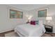 Cozy bedroom features wood-look flooring, neutral paint and two windows for ample natural lighting at 230 Shady Cove Rd, Troutman, NC 28166