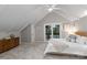 Bright bedroom with a ceiling fan, natural light, and a sliding door overlooking the water at 230 Shady Cove Rd, Troutman, NC 28166