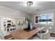 Dining room with water view, crown molding, and an open doorway to the living room at 230 Shady Cove Rd, Troutman, NC 28166