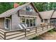 Charming waterfront home featuring a large deck, perfect for outdoor entertaining and enjoying the scenery at 230 Shady Cove Rd, Troutman, NC 28166
