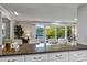 An open kitchen with views of the lake through sliding glass doors provides great natural light at 230 Shady Cove Rd, Troutman, NC 28166