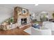 Cozy living room with stone fireplace and breakfast bar overlooking kitchen and dining room at 230 Shady Cove Rd, Troutman, NC 28166