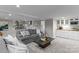 Comfortable living room with a wet bar, plenty of seating, and an open concept to the upper floor at 230 Shady Cove Rd, Troutman, NC 28166