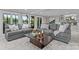 Bright open concept living room with two gray couches and a view of the water at 230 Shady Cove Rd, Troutman, NC 28166