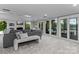 Bright living room features lake views and a fireplace with doors to the outdoor patio at 230 Shady Cove Rd, Troutman, NC 28166