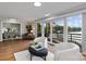 Open floor plan living room boasting hardwood floors and lake view through sliding glass doors at 230 Shady Cove Rd, Troutman, NC 28166