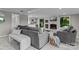 Cozy living room with brick fireplace, built-in cabinets, and sliding doors to outside deck at 230 Shady Cove Rd, Troutman, NC 28166