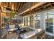 Outdoor living space of the screened porch with outdoor furniture and views of the lake at 230 Shady Cove Rd, Troutman, NC 28166