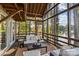 The screened-in porch provides outdoor living space with beautiful views of the lake at 230 Shady Cove Rd, Troutman, NC 28166