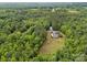 Aerial view of secluded home surrounded by lush forest at 230 Shag Bark Ln, Salisbury, NC 28146
