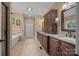 Beautiful bathroom featuring dual sinks, a soaking tub, and a large closet at 230 Shag Bark Ln, Salisbury, NC 28146