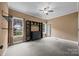 Spacious bedroom with neutral carpet, ceiling fan, and a wall of built-in shelving at 230 Shag Bark Ln, Salisbury, NC 28146