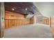 Large bonus room with a wood paneled accent wall and mini split system at 230 Shag Bark Ln, Salisbury, NC 28146