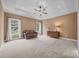Spacious bonus room with a tray ceiling, plush carpeting, and two bright windows at 230 Shag Bark Ln, Salisbury, NC 28146