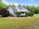 Well-maintained home with manicured landscaping and a sprawling green lawn at 230 Shag Bark Ln, Salisbury, NC 28146