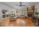 Open-concept living room features a stone fireplace, hardwood floors, and plenty of natural light at 230 Shag Bark Ln, Salisbury, NC 28146