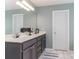 Well-lit bathroom with a gray vanity, white countertops, and sleek fixtures at 2339 Wednesbury Ct, Kannapolis, NC 28083