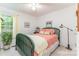 Bright bedroom with a green bed frame, window, and natural lighting at 2339 Wednesbury Ct, Kannapolis, NC 28083