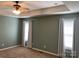 Spacious carpeted bedroom with ceiling fan, modern recessed ceiling and plenty of natural light at 2339 Wednesbury Ct, Kannapolis, NC 28083
